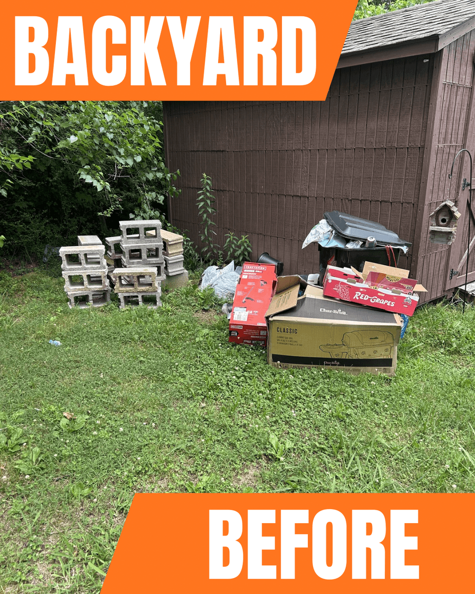 Junk and old materials piled by a shed before property cleanout