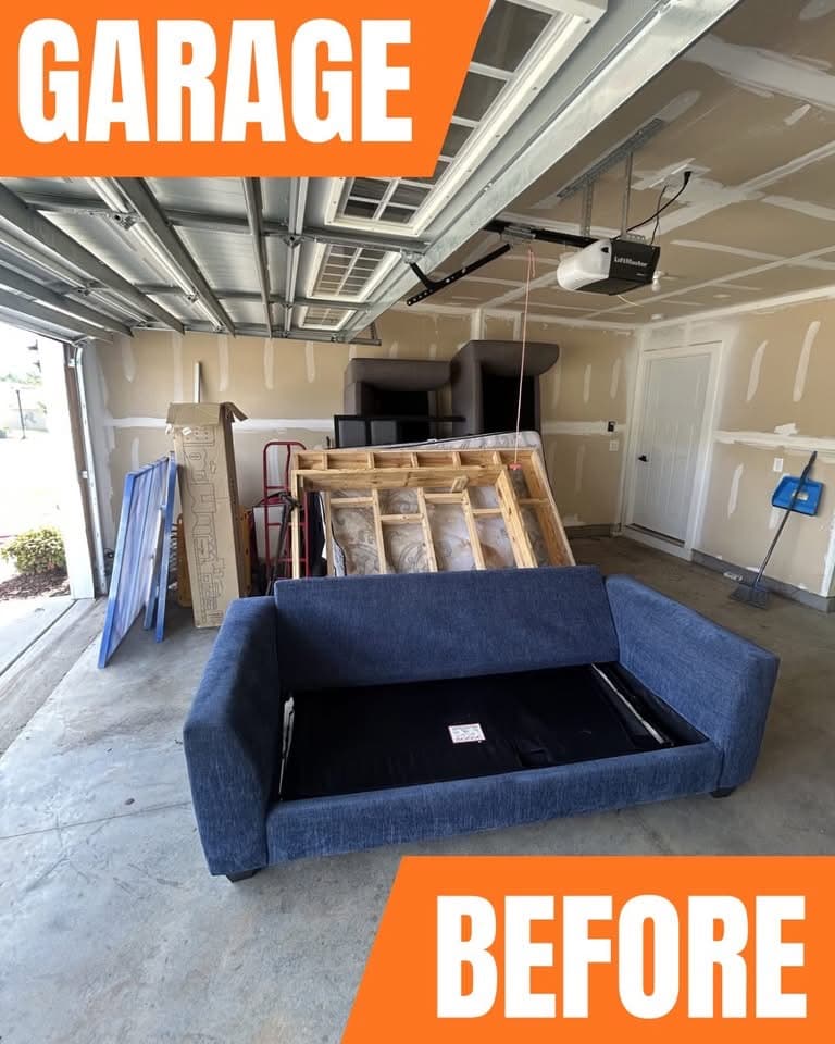 Right garage bay cluttered with stored items before cleanout